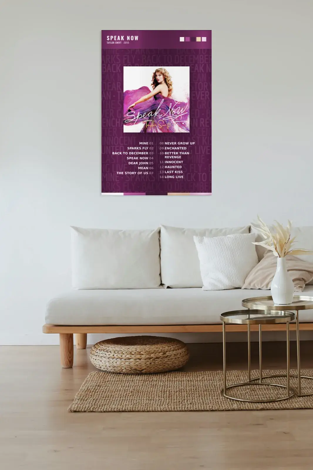 Album art metal print mounted on a minimalist white wall above a modern sofa